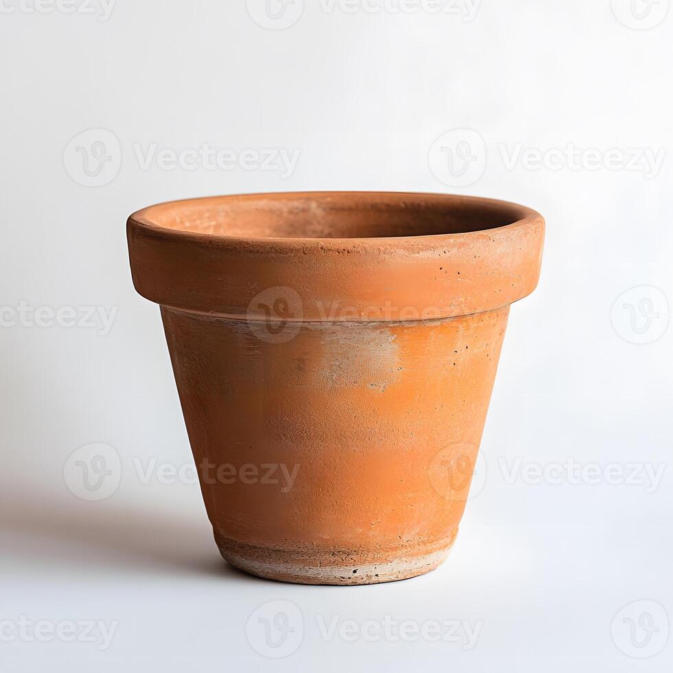 A Terracotta Pot Stands On A White Background photo