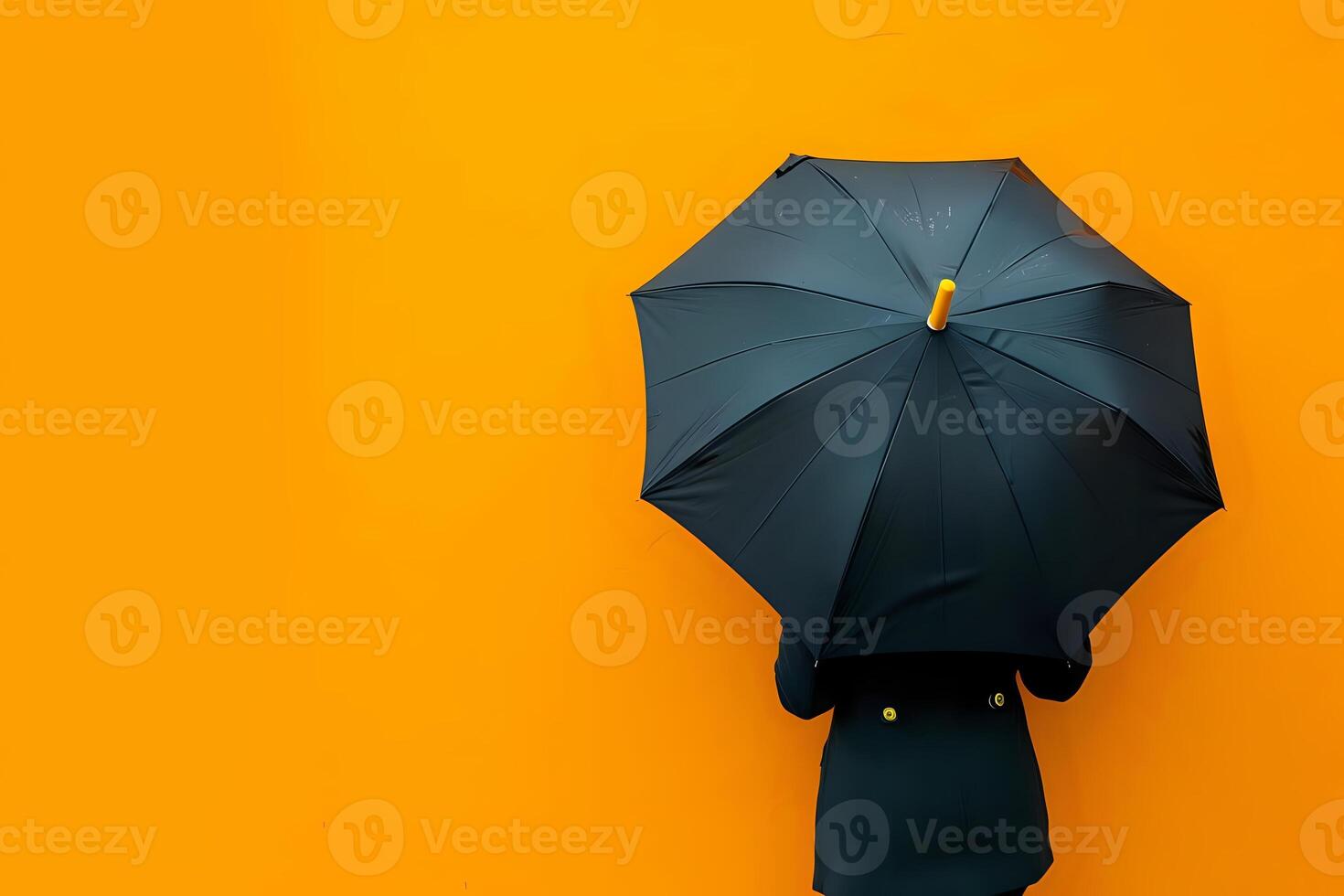 A Person Holds a Black Umbrella Against a Vibrant Orange Background, Creating a Striking Contrast and Evoking a Sense of Mystery and Protection. This Visual Metaphor Represents Resilience photo