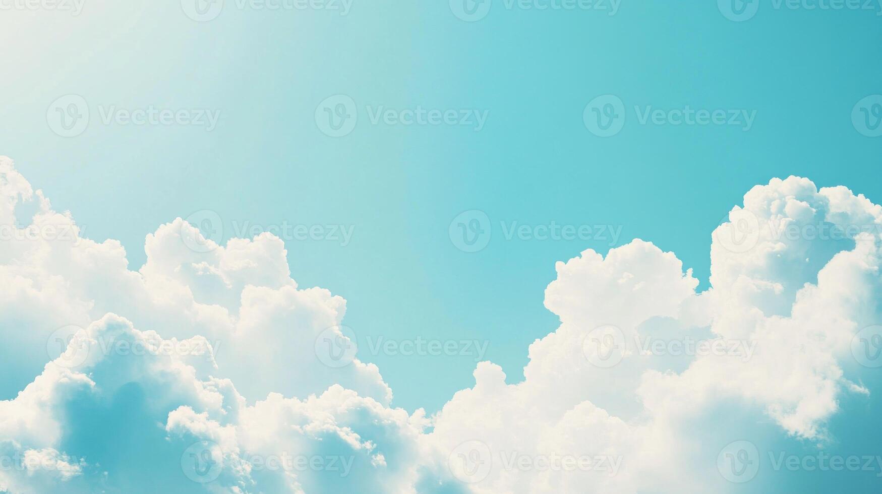 White Fluffy Clouds Against a Light Blue Sky photo