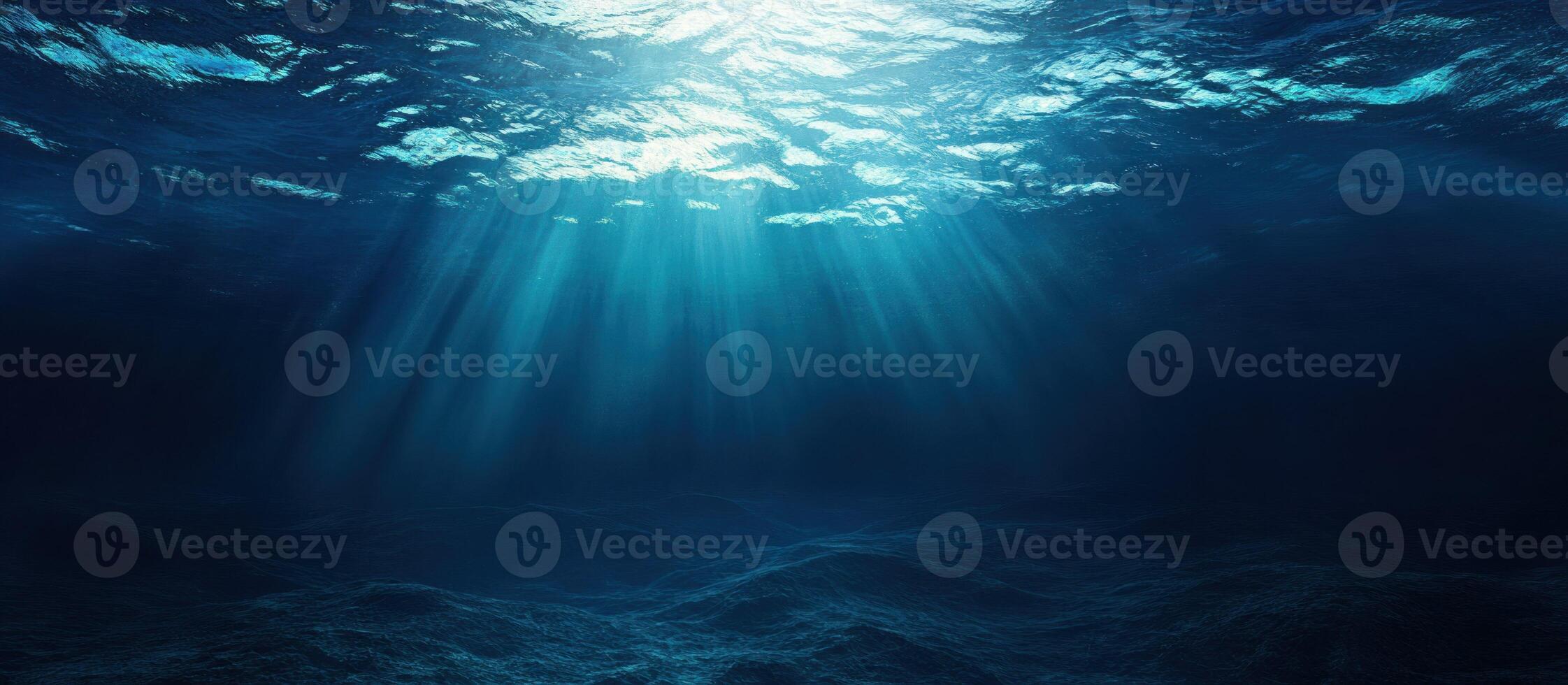 Underwater View of Sunlight Rays and Ocean Floor photo
