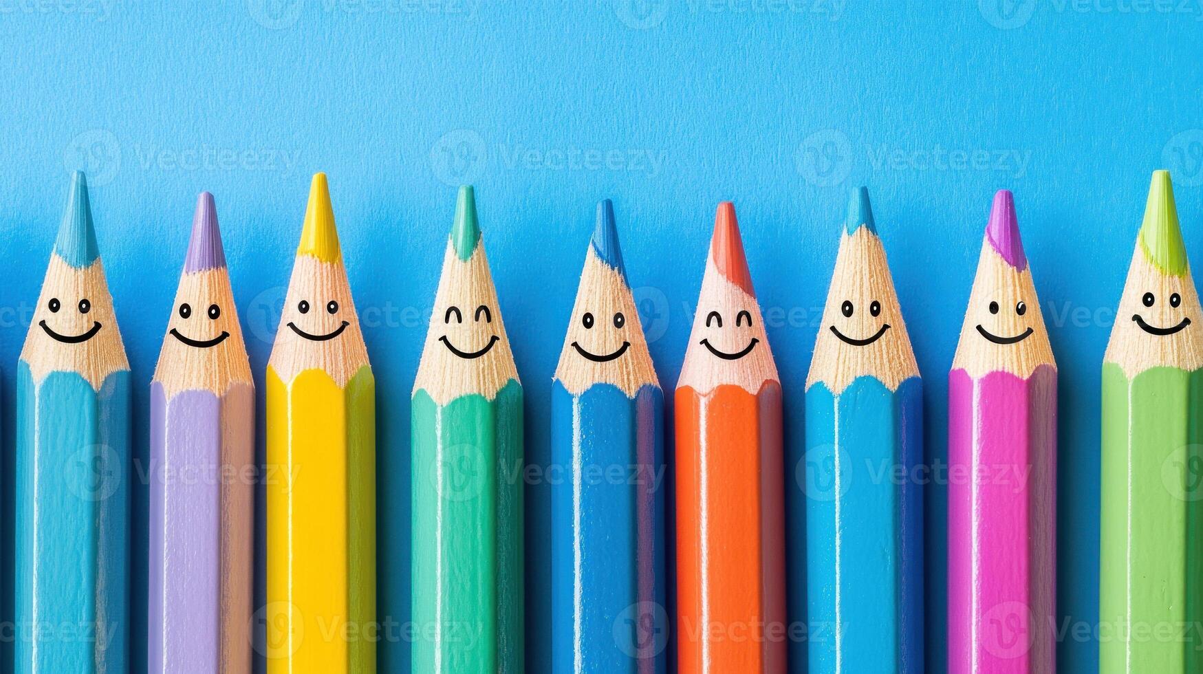 Colorful Pencils With Smiling Faces on Blue Background photo