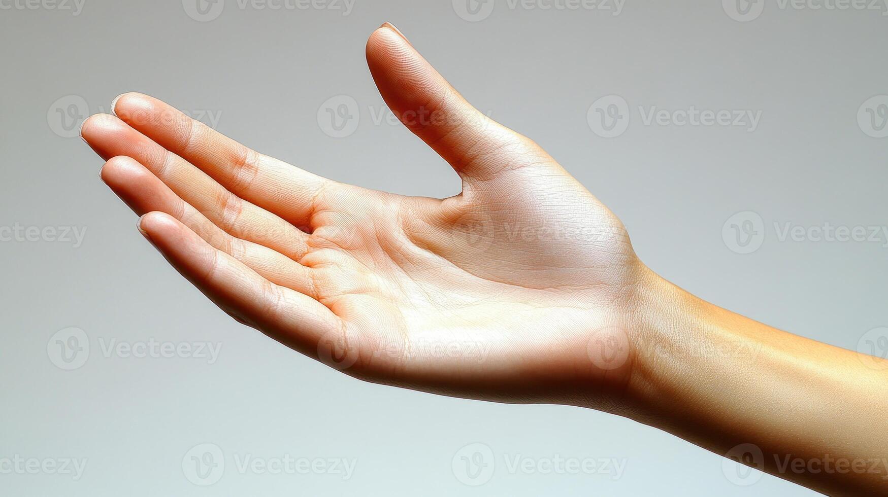 An open hand extends with warmth and invitation in gentle light photo