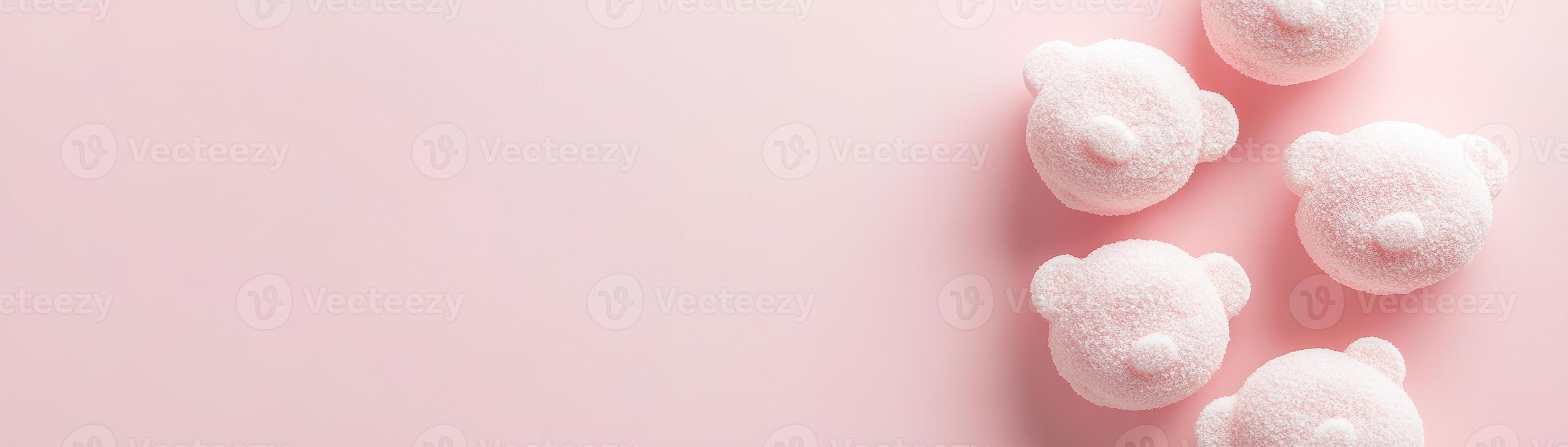 Cute child-friendly bath bomb background featuring teddy bear shapes in soft pastel tones on a smooth light pink surface with ample space for text photo