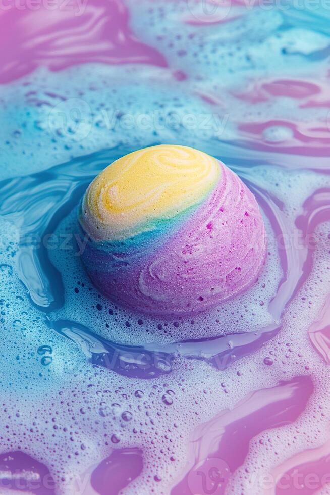 Vibrant rainbow-colored bath bomb dissolving in water creates swirling patterns in playful abstract background photo