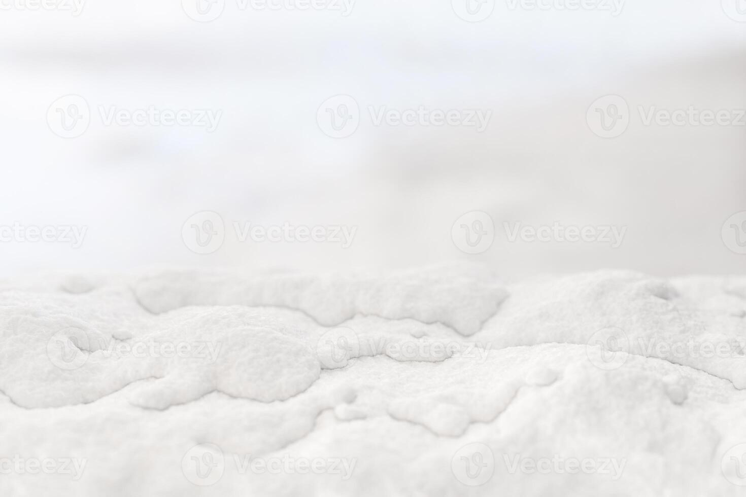 Soft white snow texture close-up with a blurred background, creating a minimalistic winter atmosphere. Perfect for seasonal projects, holiday themes, and natural design elements. 3D rendering. photo