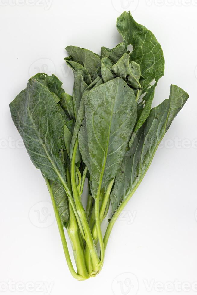 Chinese kale on a white background, close-up, isolated. photo