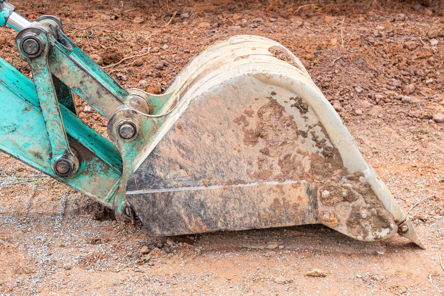 Close-up of a bulldozer on the ground in construction site photo