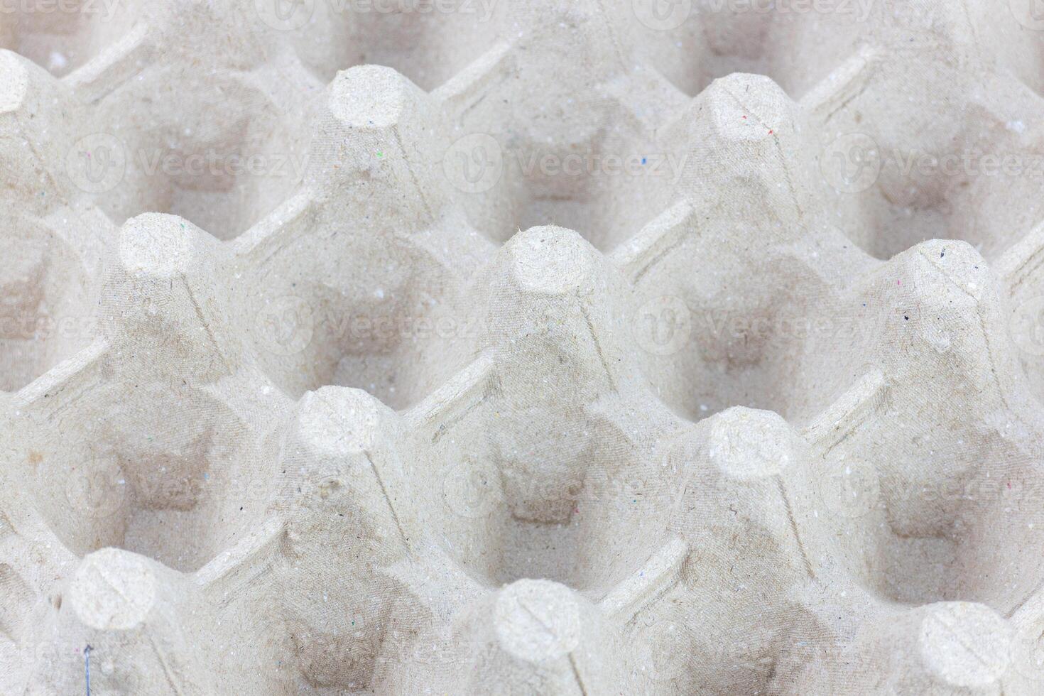 Empty egg carton box, closeup of photo, texture background photo