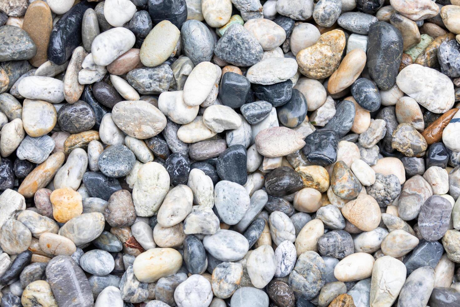 Pebble stone texture background. Pile of pebbles. photo