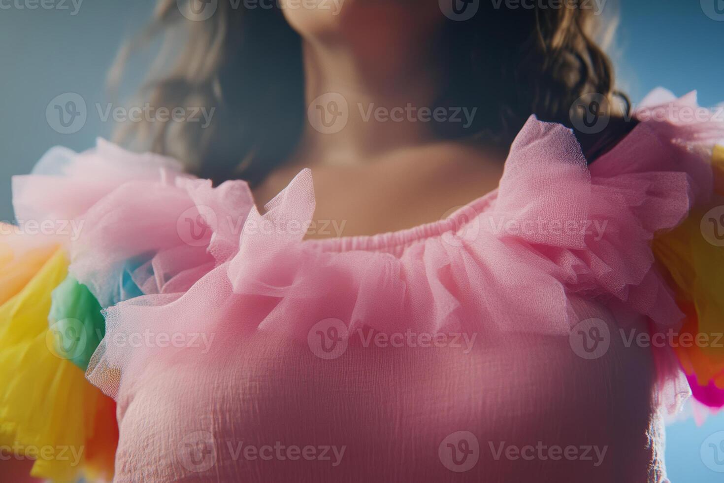 Colorful tulle ruffle top worn by a model during a vibrant fashion shoot in a studio setting with soft lighting photo