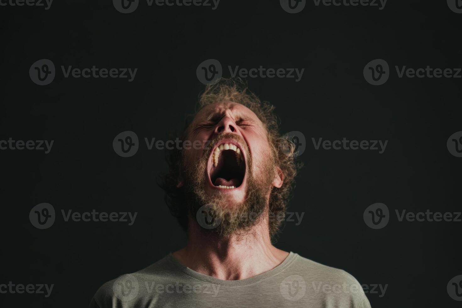 A man with a beard and beard is screaming photo