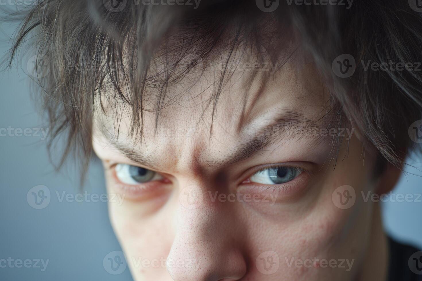 A man with a serious expression on his face photo