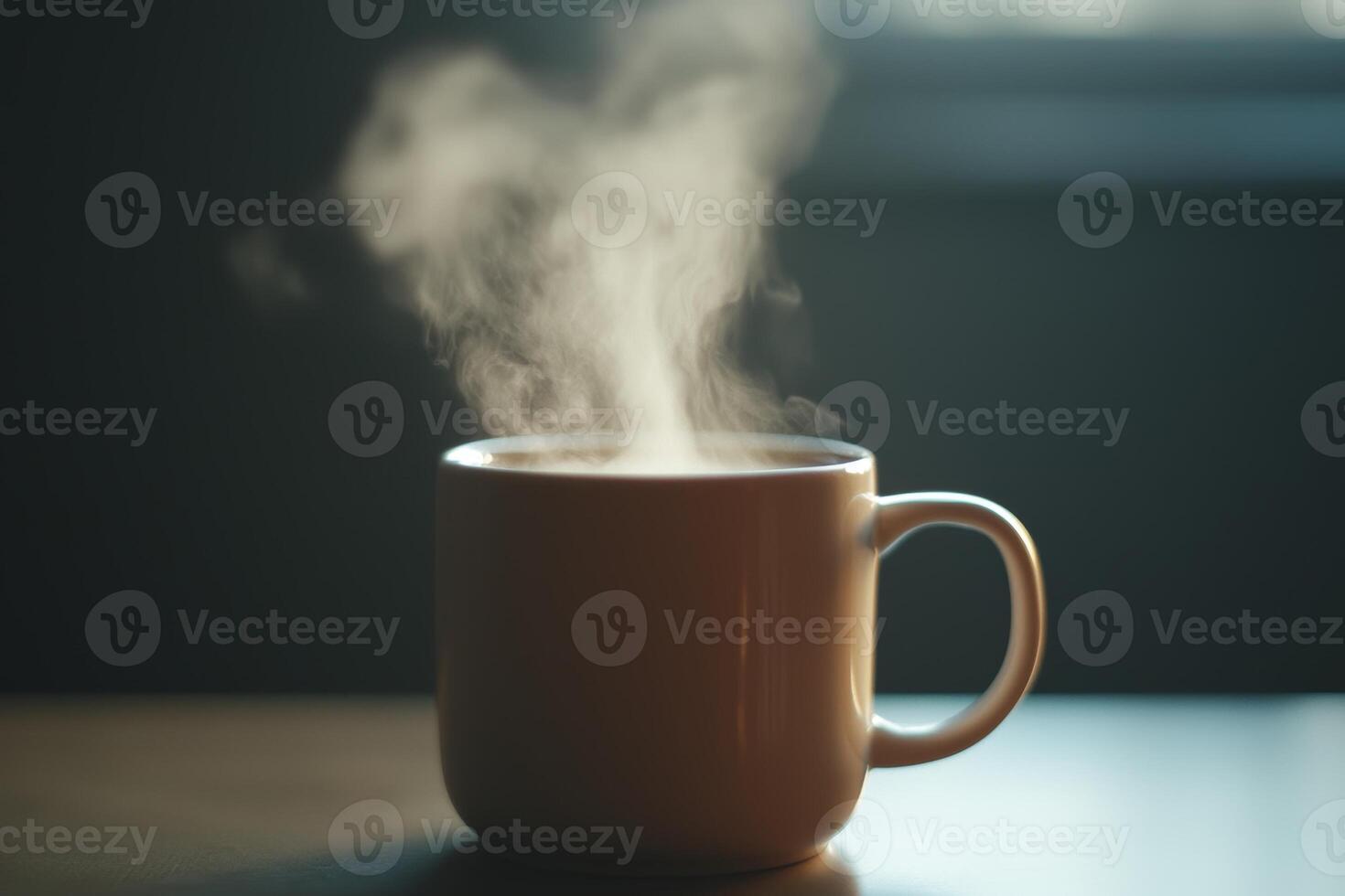 A steaming cup of coffee rests on a wooden table in a cozy room during the morning sunlight hours photo