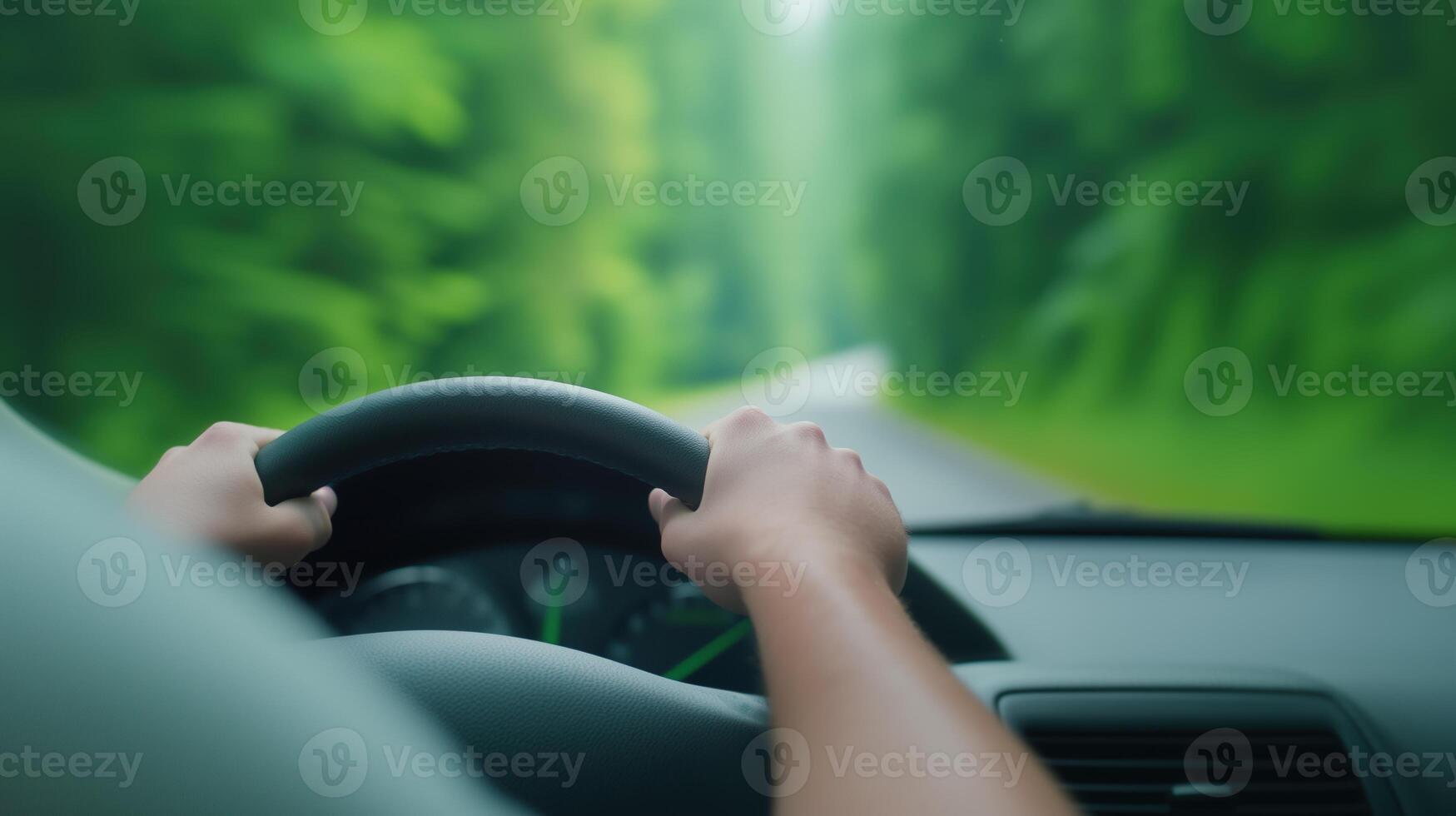 Handheld View of Fast Car Driving on Forest Road Focusing on Steering Wheel and Blurred Greenery for Speed and Motion Concept in Stock Photography photo