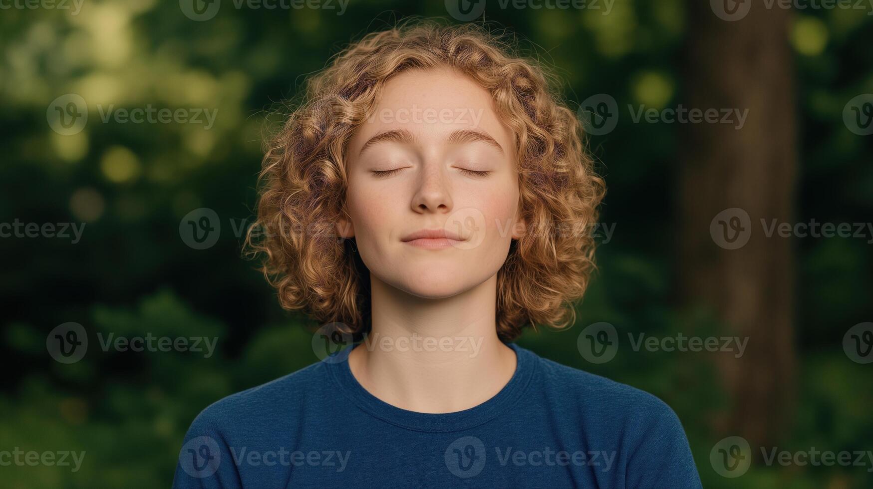 Tranquil Young Woman Meditating Outdoors in Nature with Eyes Closed Practicing Relaxation and Stress Relief Techniques Surrounded by Greenery in Serene Natural Environment for Mindfulness photo