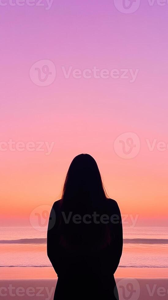 Tranquil Woman Silhouette Watching Sunset Over Calm Beach Horizon with Vibrant Sky and Serene Ocean in Minimalist Style Epic Scene photo
