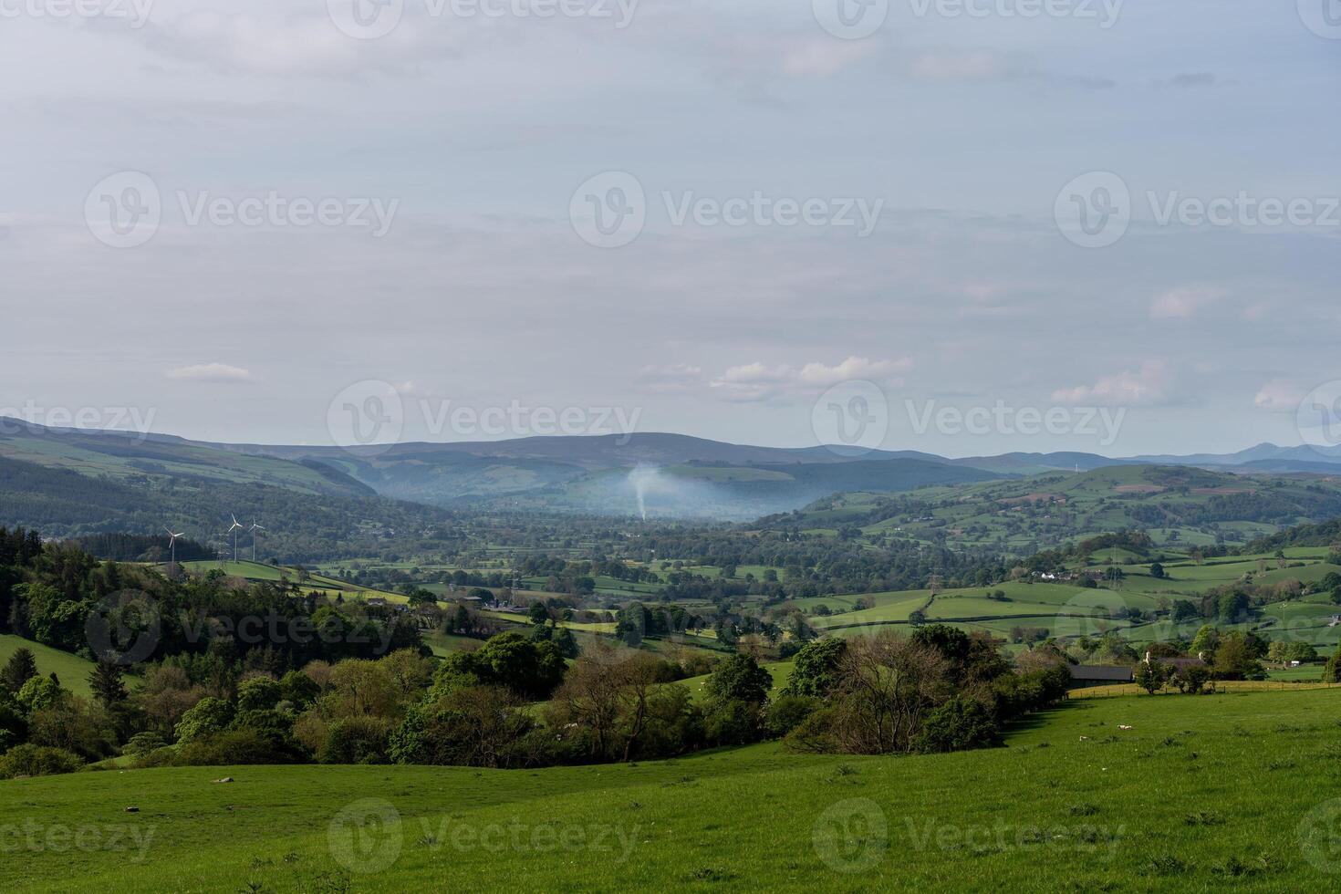 Serene rural landscape with rolling hills photo