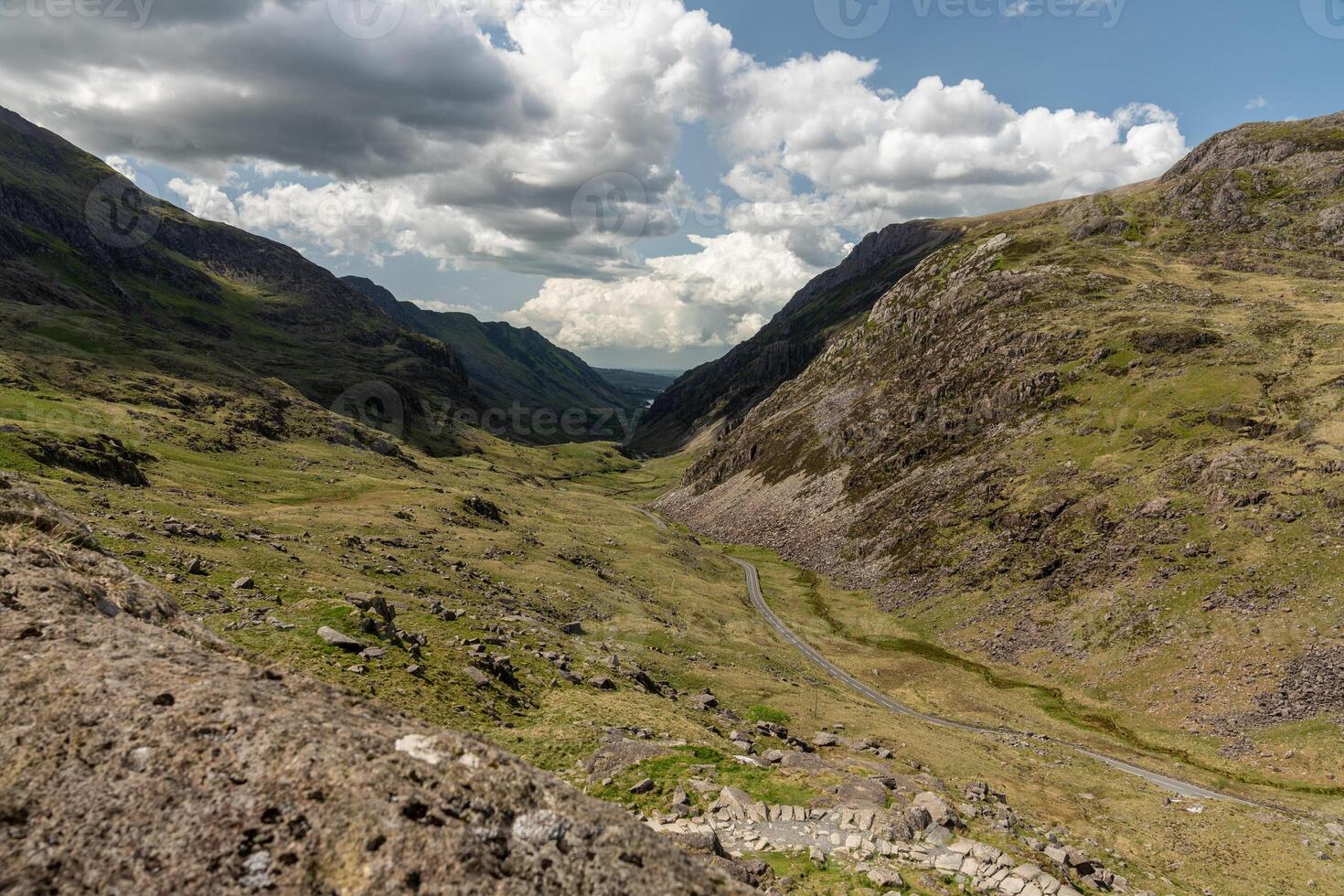 Scenic view of a vast mountain valley under a dramatic sky, capturing nature's grandeur photo