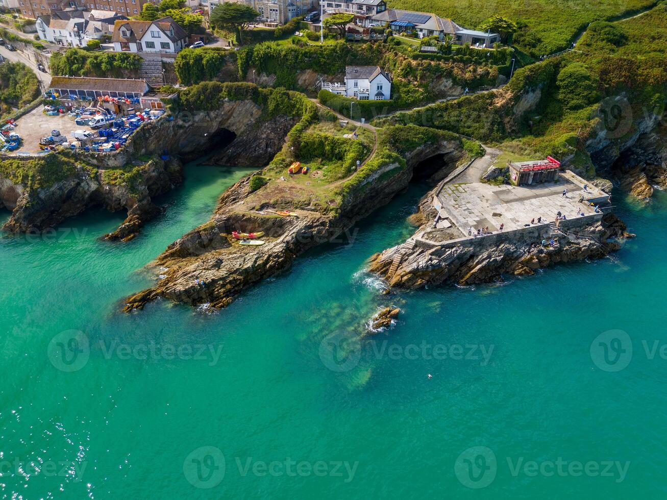 Aerial view of newquay harbor showing turquoise water and kayaks photo