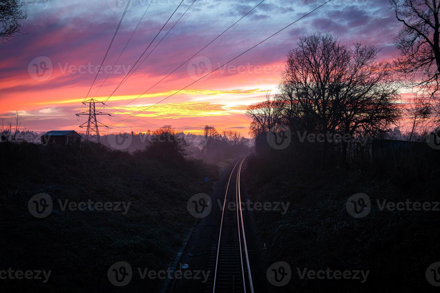 Plymouth Railway Disappearing into Colorful Sunrise in Plymouth, United Kingdom photo