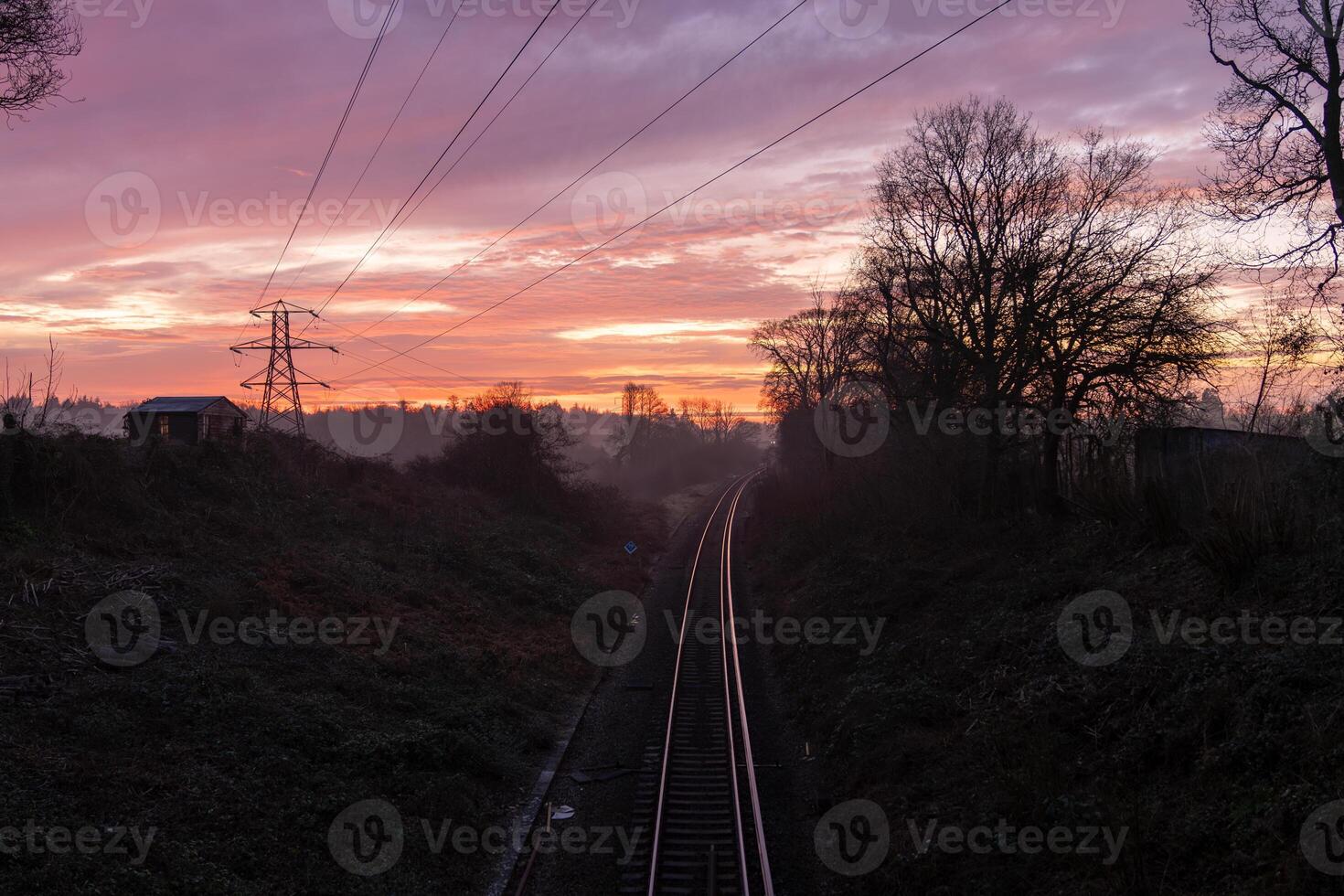 Plymouth Railway disappearing into the fog during a colorful sunrise in Plymouth, England photo