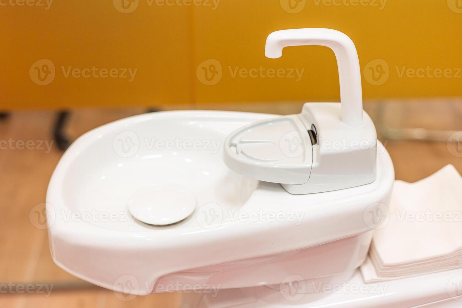 Modern dentist sink providing comfort and hygiene during dental procedures photo