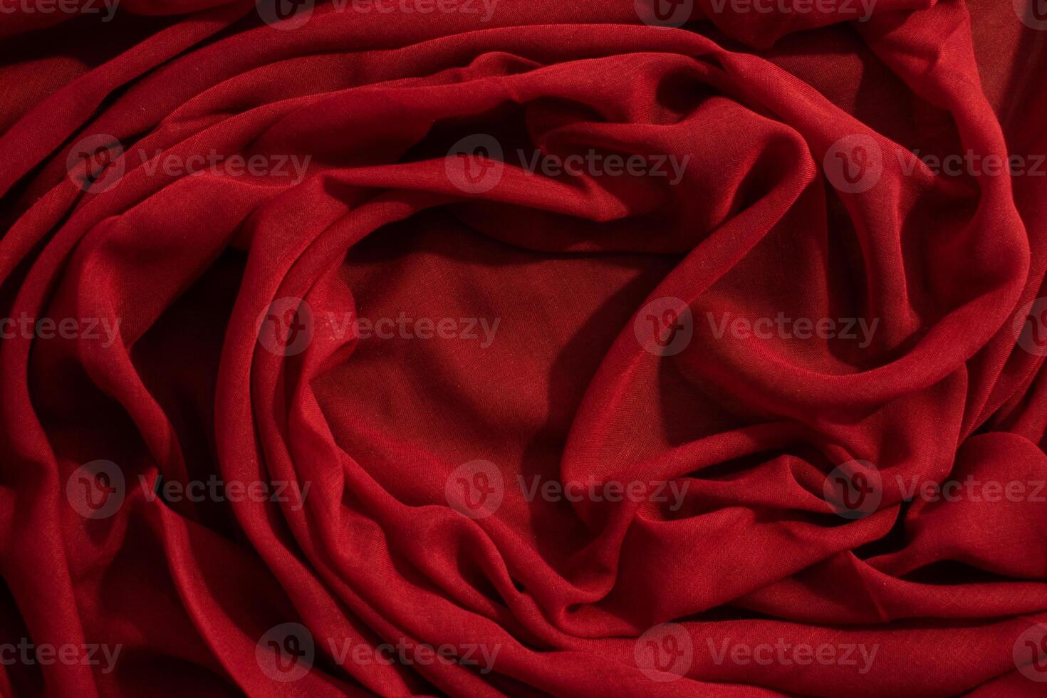 wavy crumpled abstract background texture Red rose fabric with copy space. photo