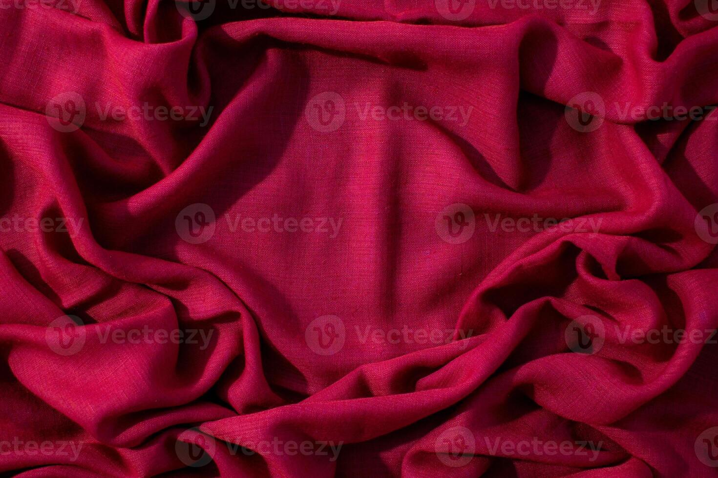 wavy crumpled abstract background texture Red fabric with copy space. photo