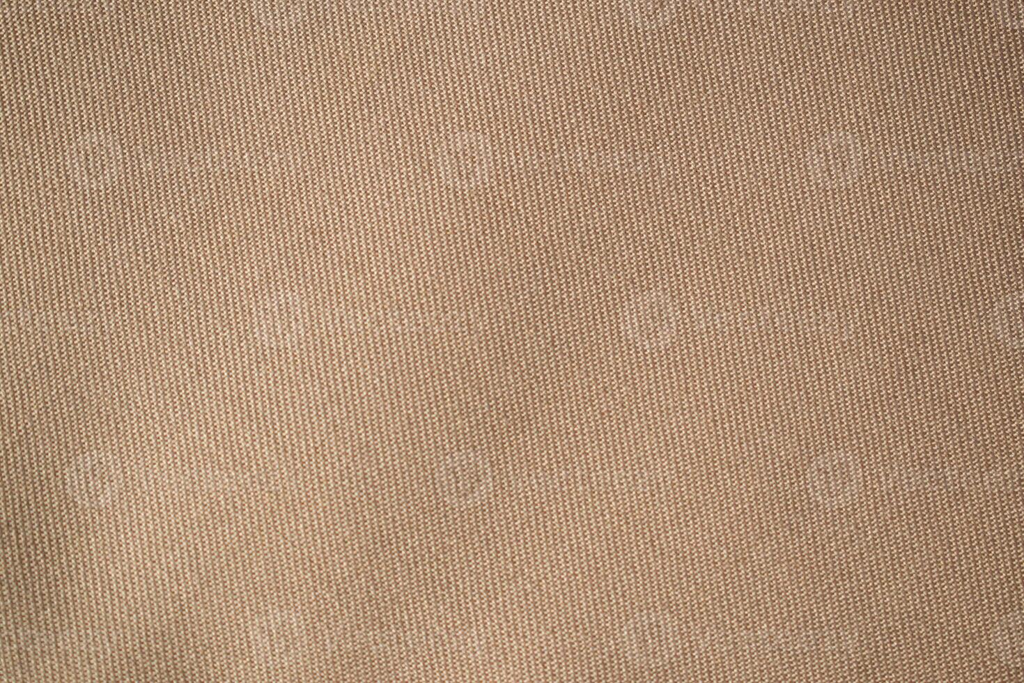 flat view Light brown pattern fabric texture background. photo