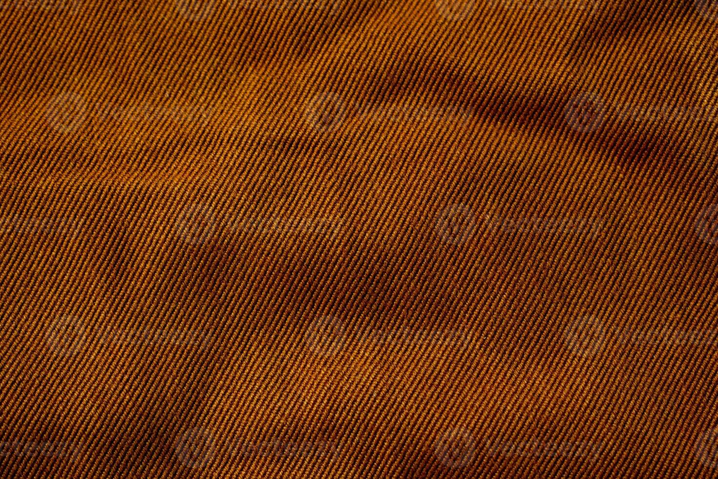 bright brown jeans fabric background texture. photo