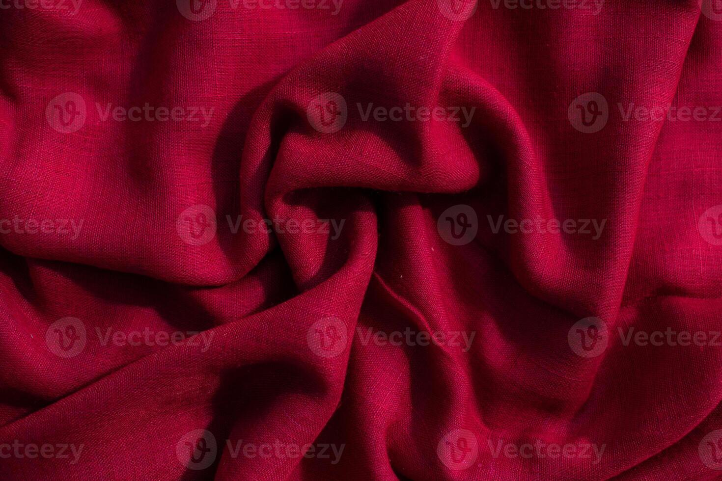 abstract background Red fabric wavy crumpled texture. photo
