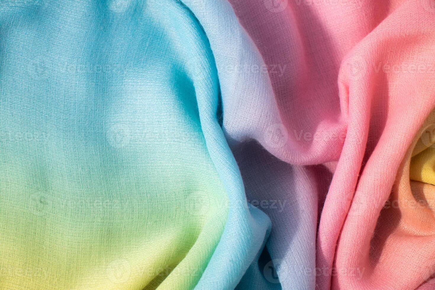 Gradient rainbow fabric wavy spiral crumpled background texture with copy space. photo