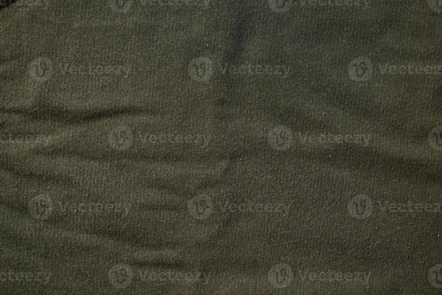 Flat view Green army fabric texture background. photo