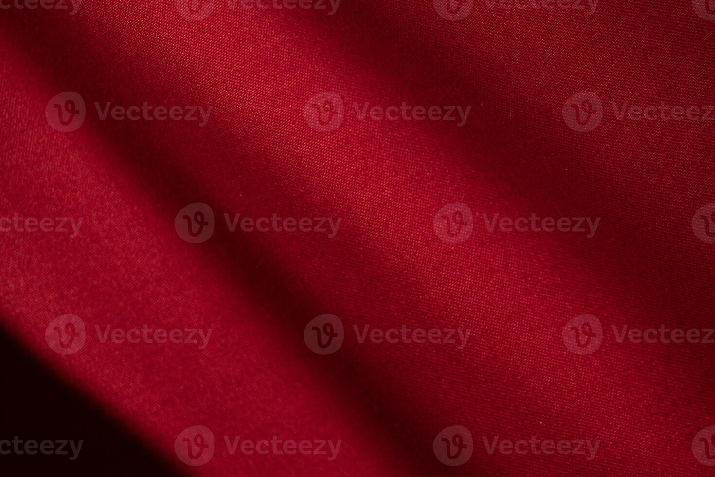 Diagonal Wavy Red fabric abstract background texture. shiny, glossy and elegant background. photo