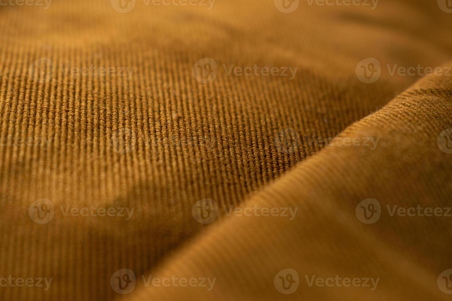 Close up bright brown jeans fabric abstract background texture. photo
