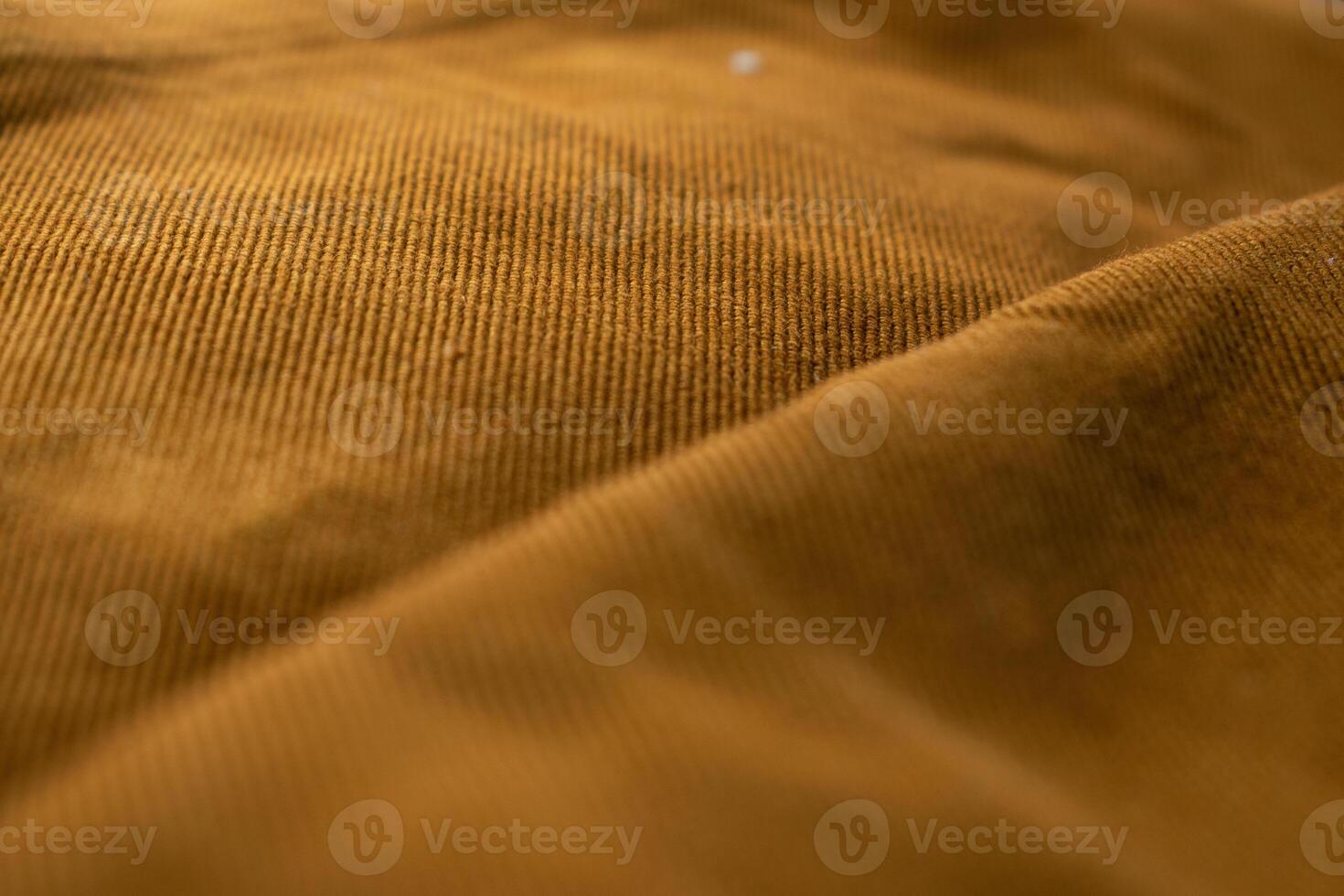 Close up detailed bright brown jeans fabric abstract background texture. photo