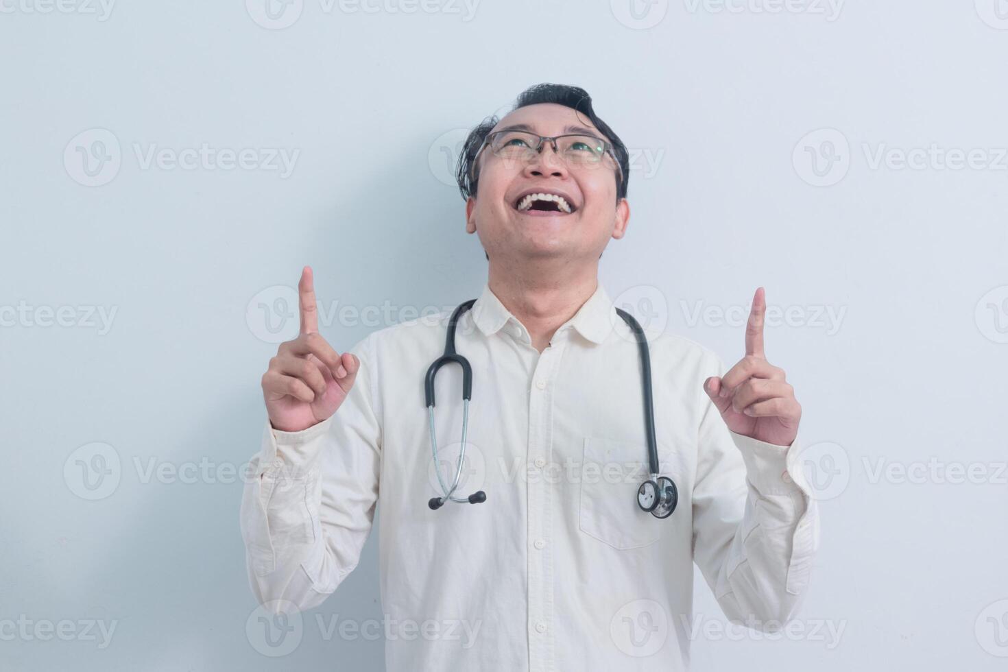 smiling Asian man doctor, nurse pointing pose isolated white background. photo