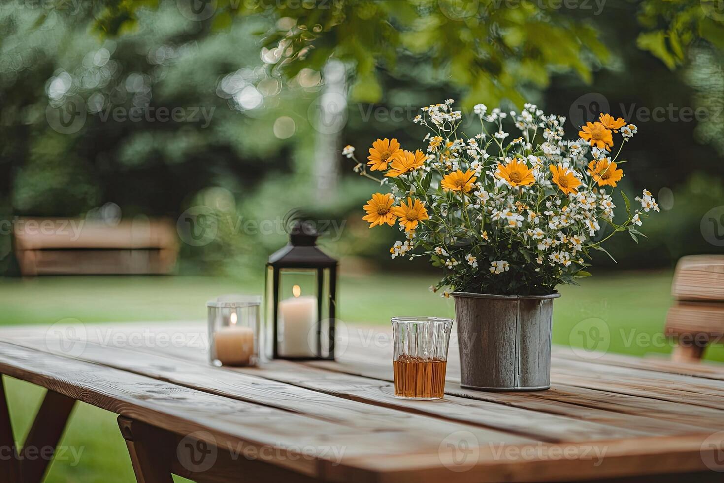 Bouquet of chamomile flowers in vase on wooden table photo