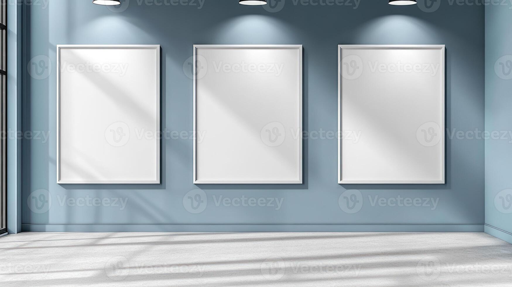 Bright sunlight streams through large windows, illuminating blank frames on the wall photo