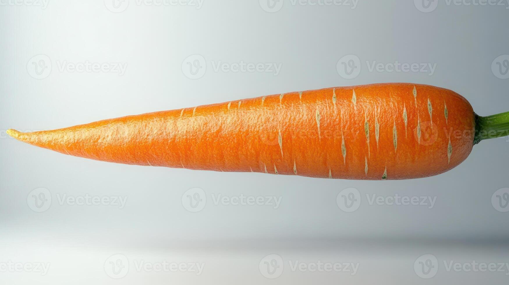 An elegant carrot showcasing its vibrant orange color and smooth surface photo