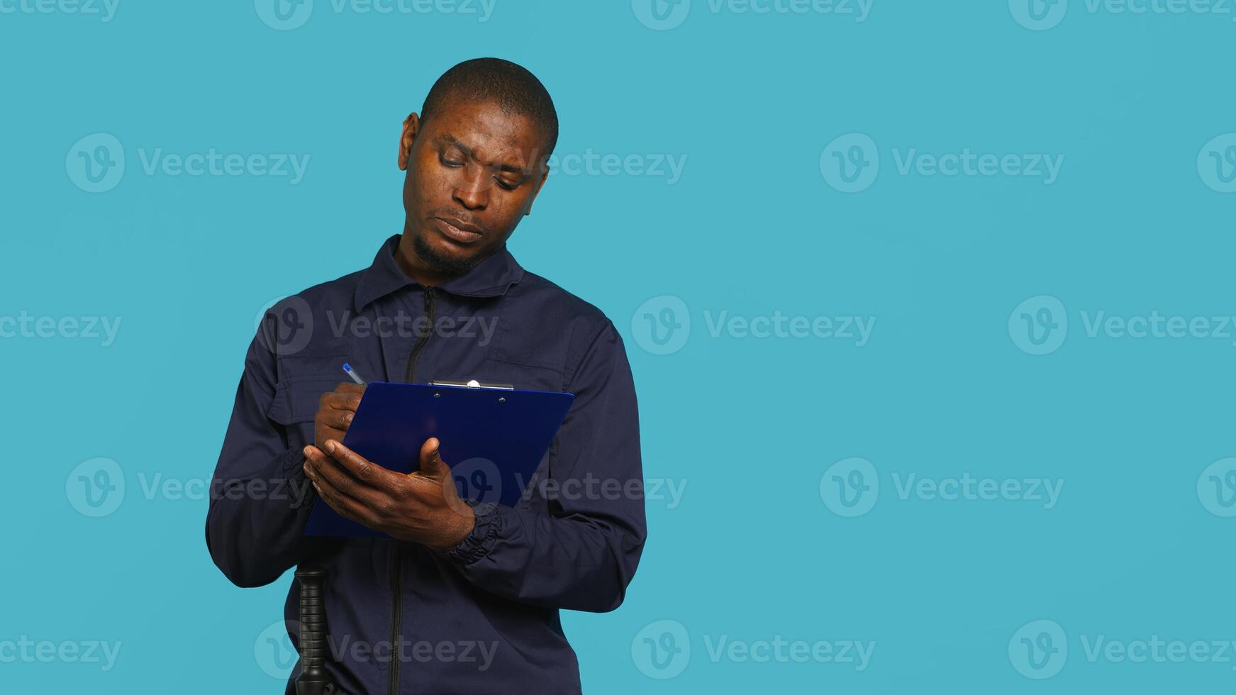 Portrait of security staff member tasked with evicting trespassers while following legal protocols. Patrolling agent maintaining secure environment, studio background, camera A photo