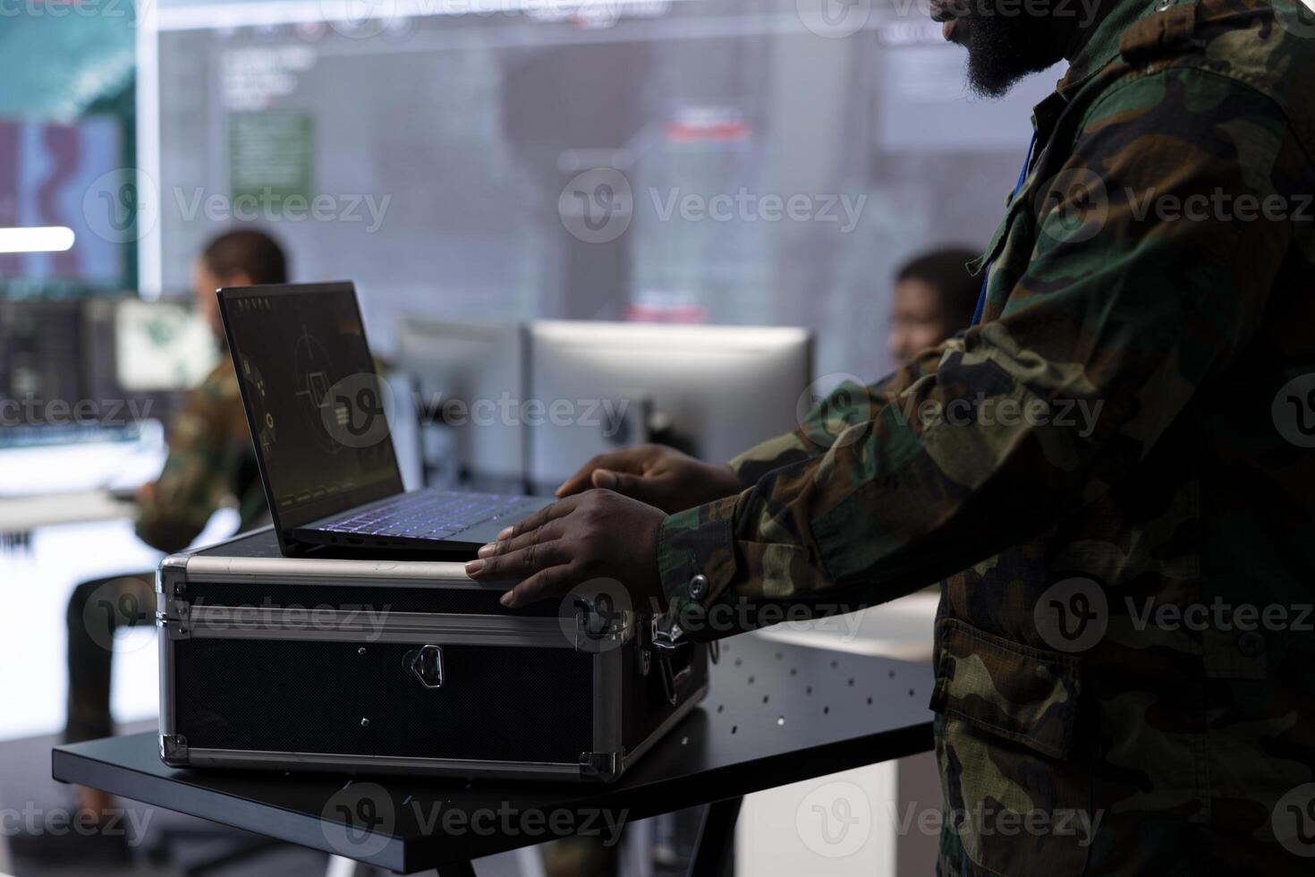 Government intelligence expert works on laptop in a command center to manage surveillance operations, collecting real time data for security measures. Protecting national interests for efficiency. photo