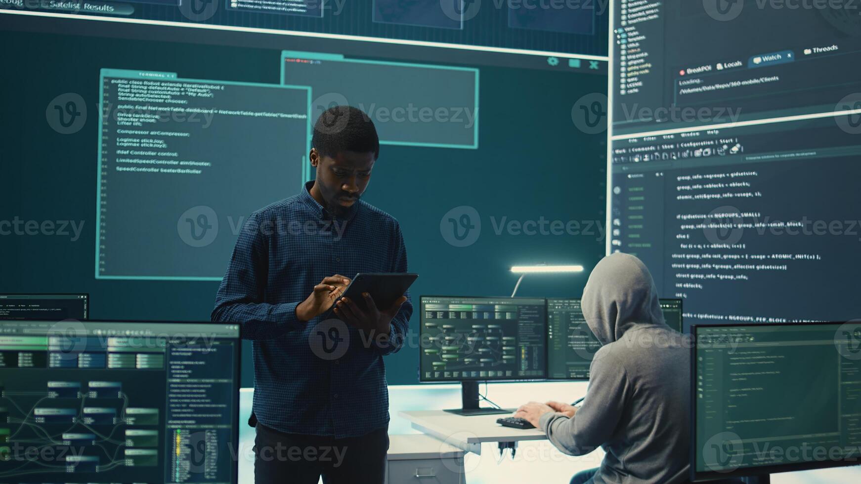 Cyber intelligence team defending against cyber threats and espionage. Governmental hacker using advanced technology to access information and secure networks, monitors high tech facility. Camera B. photo