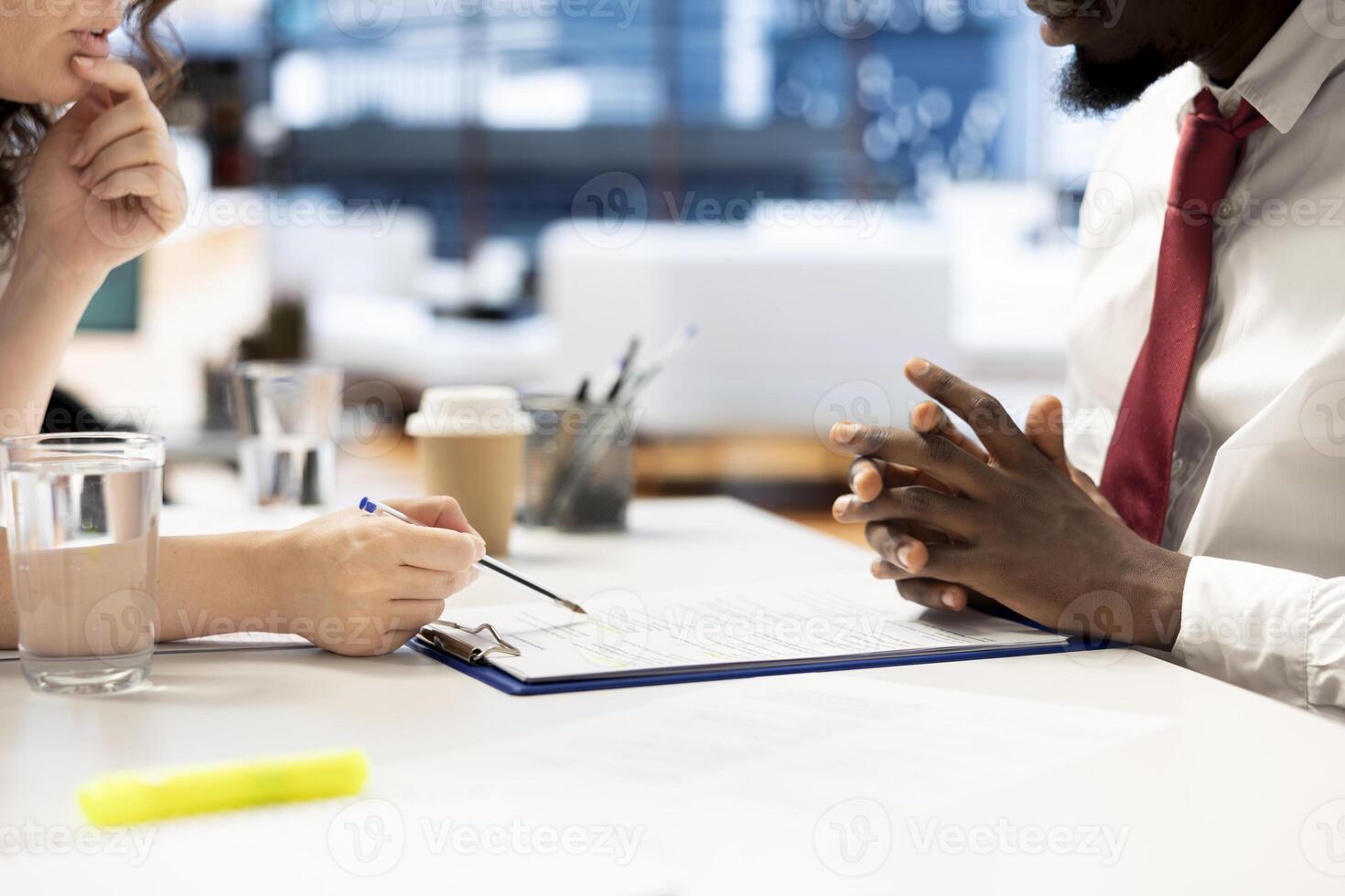 HR department worker reviewing candidate resume while asking questions about qualifications. Applicant at interview in office proving skills, showcasing expertise and enthusiasm for job opportunity photo