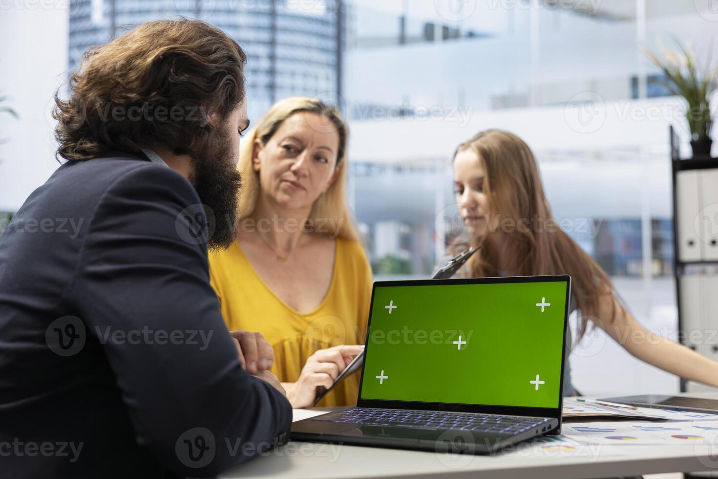 Financial advisor making investment performance analytic report on green screen laptop for clients. Agent preparing portfolio economic evolution summary for family on chroma key notebook photo