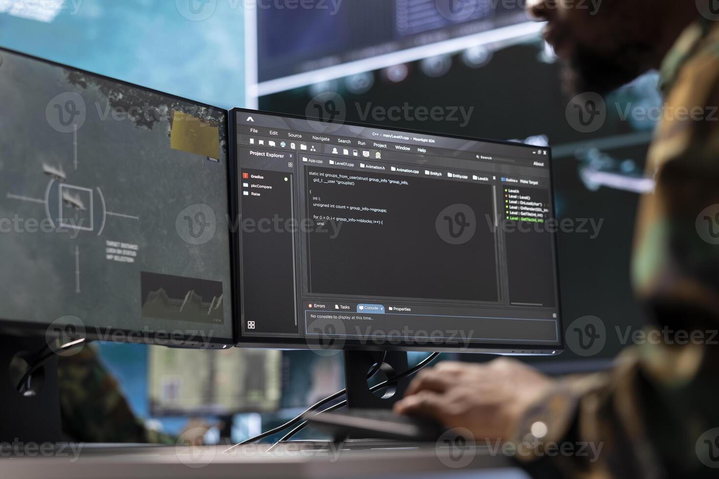 IT analyst in a high tech base of operations handling surveillance activity and ensuring security protocols. Military command post crew collecting real time data to achieve mission objectives. photo