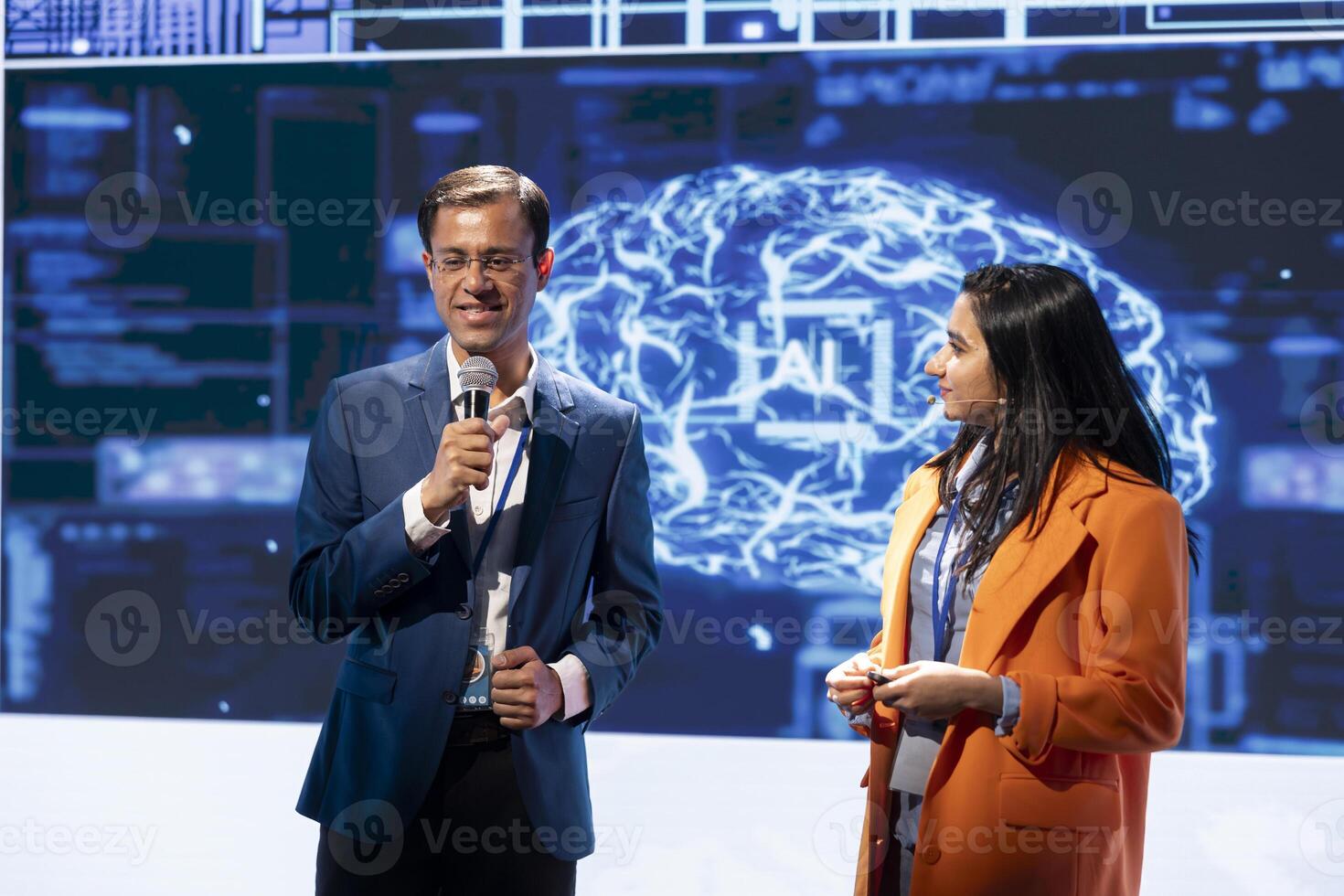 Presenter and specialist guest talking at AI summit bringing together tech startups professionals, exploring latest developments in artificial intelligence and deep learning technology photo
