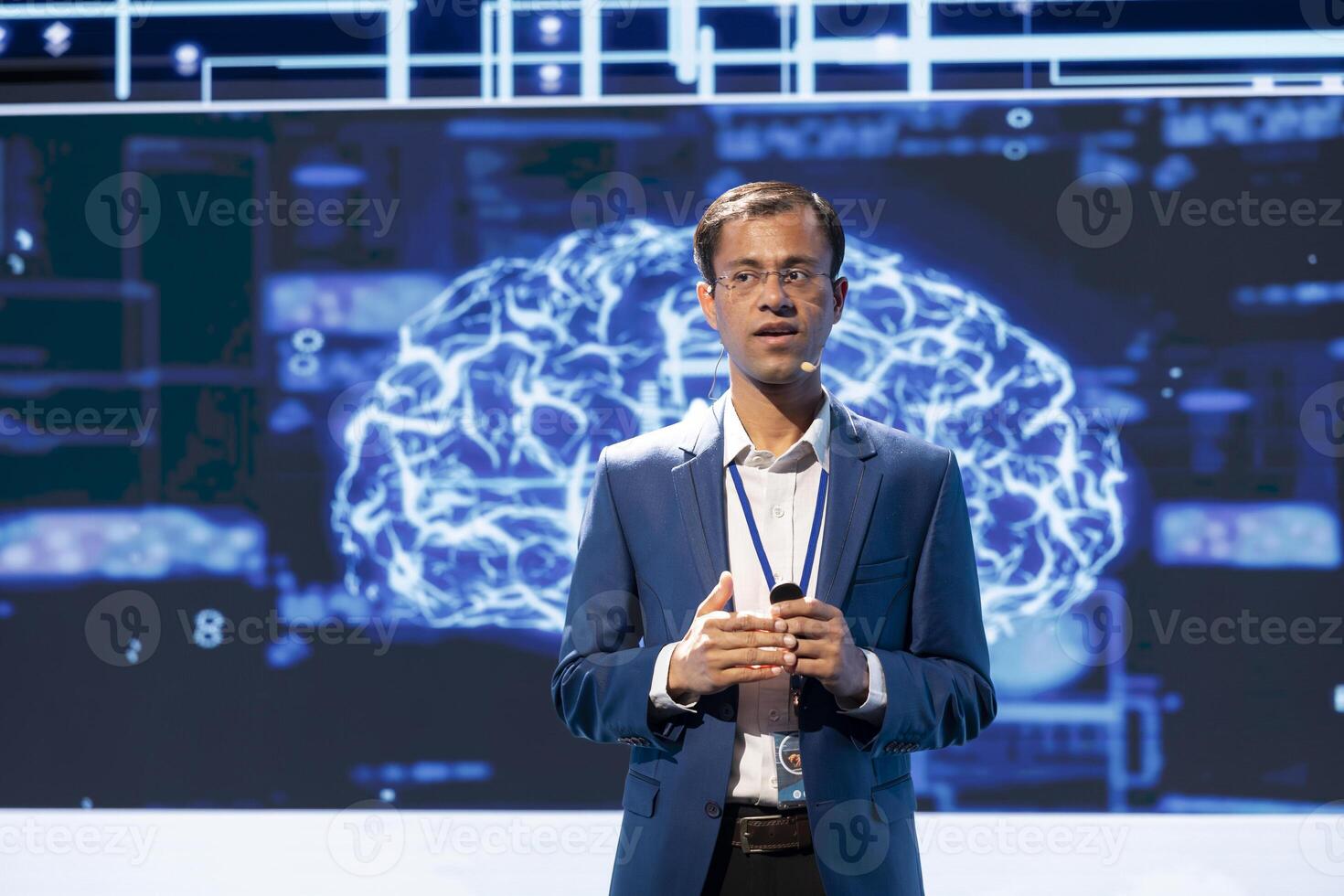 CEO presenting how AI technologies can bring increased productivity and innovation in business sector during conference. Businessman talking about implementation of AI driven solutions photo