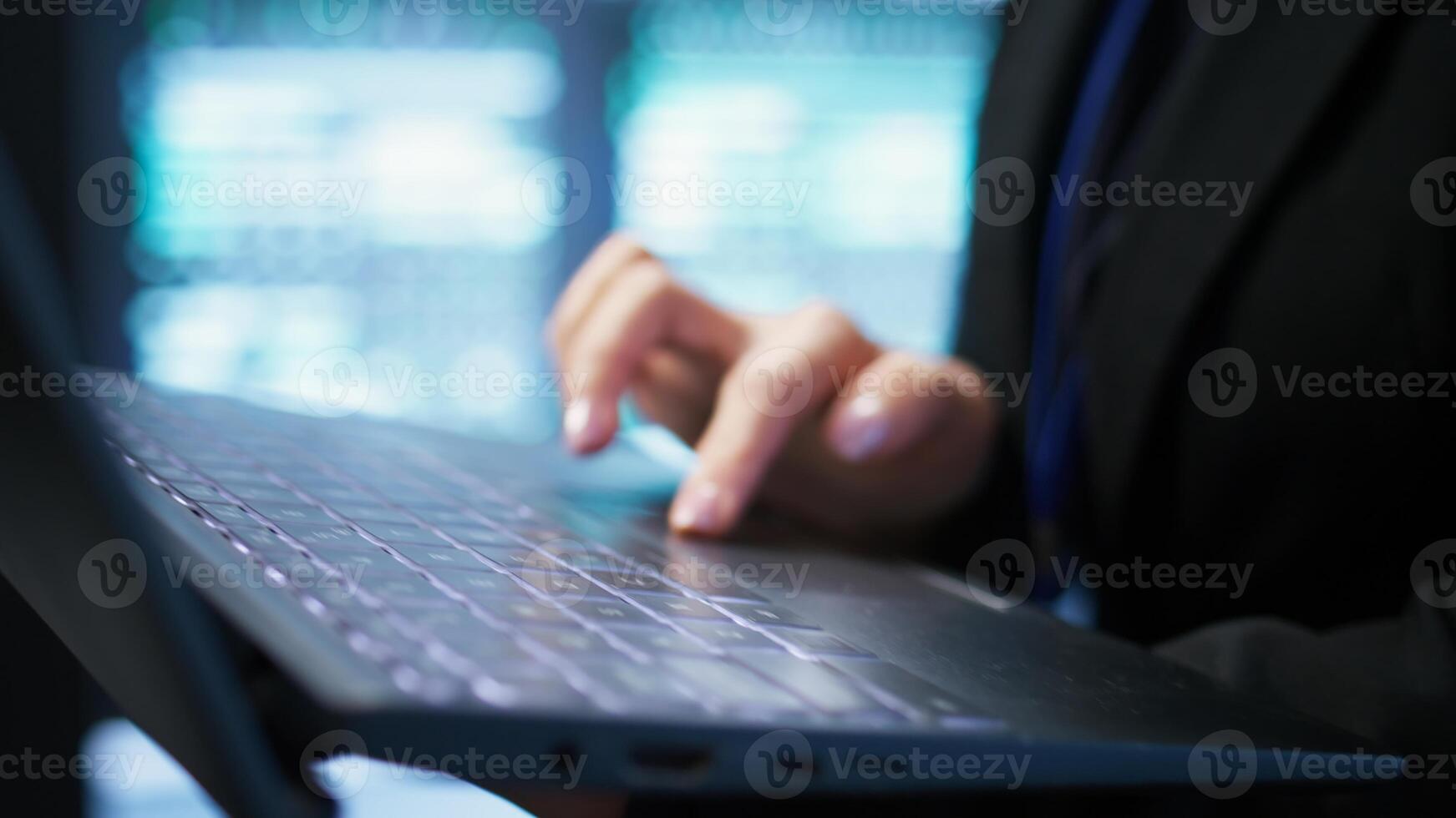 Programmer in server hub checking recovery plan on laptop, monitoring energy consumption across mainframes. Close up of employee using notebook in data center, ensuring rigs are functioning, camera B photo