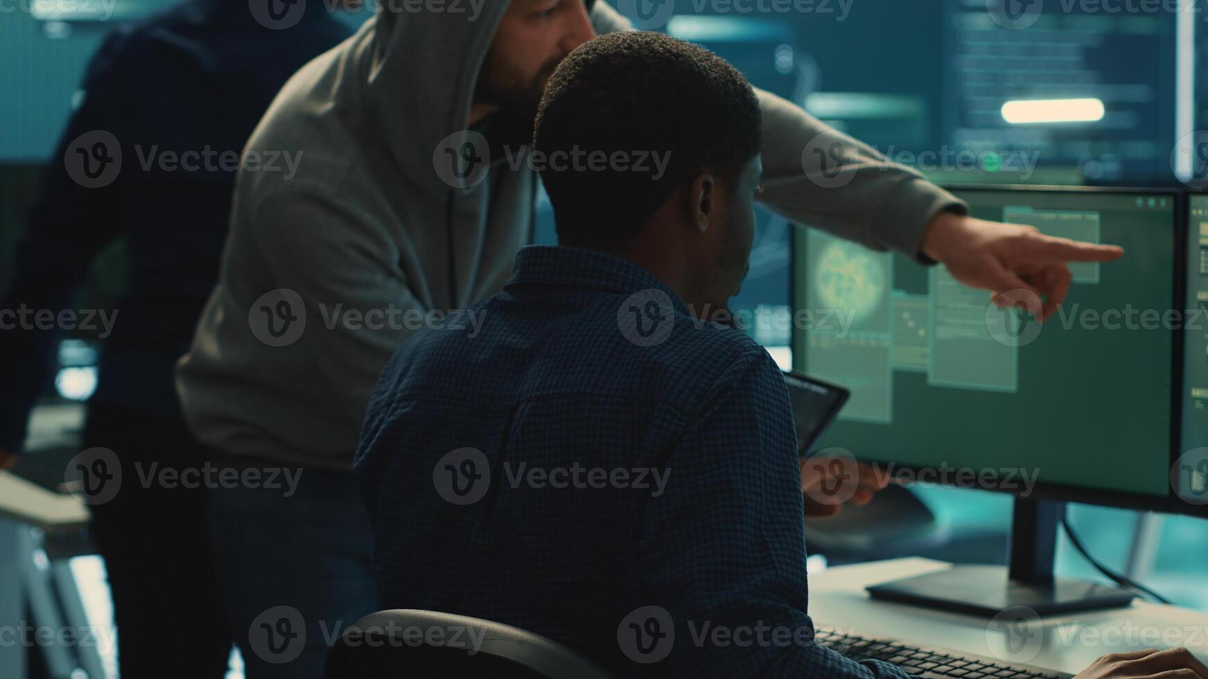 Cyber security team conducting cyber surveillance and threat detection in a governmental agency. Hackers working on cybercrime and malware prevention, data breach protection. Camera A. photo